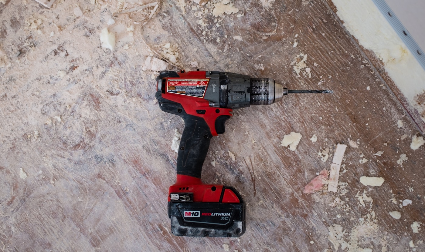 Volunteer repairing a household item at a community workshop